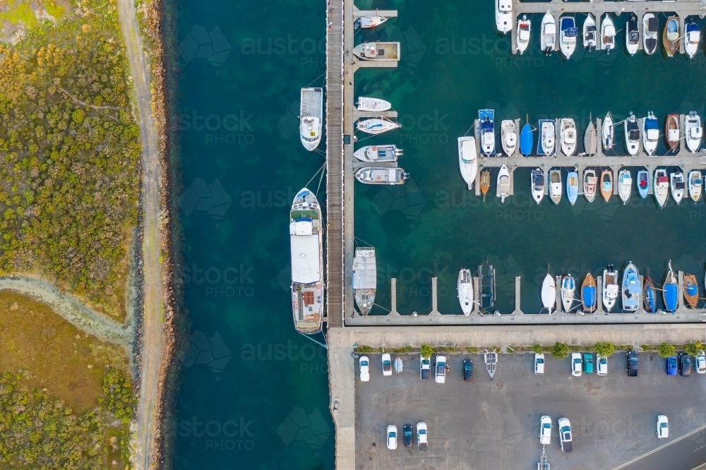 Image of Aerial view of boats and yachts anchored along jettys at a ...