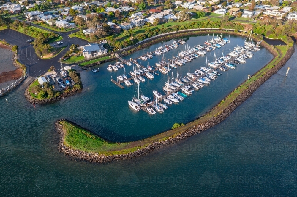 Image of Aerial view of boats and yachts anchored in a sheltered marina ...
