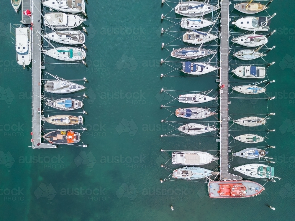 Aerial view of boats and yachts moored at a marina - Australian Stock Image