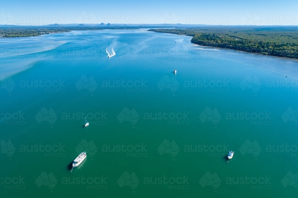 Aerial view of boats on Pumicestone Passage, Bribie Island. - Australian Stock Image
