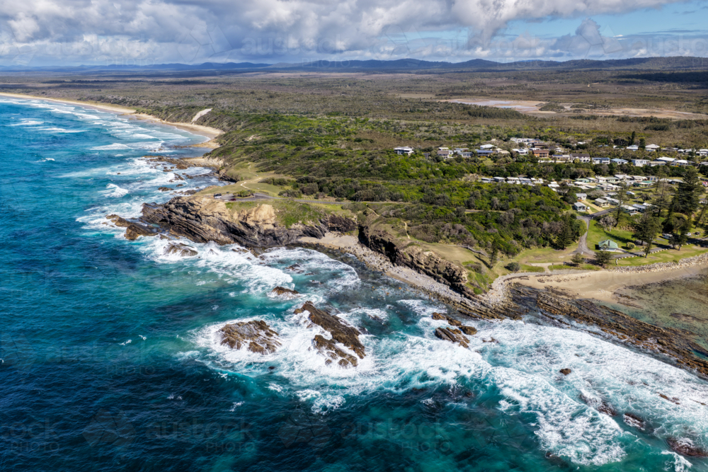 Aerial view of Brooms Head, Brooms Head Beach and Sand Dune Beach, showcasing the headland - Australian Stock Image