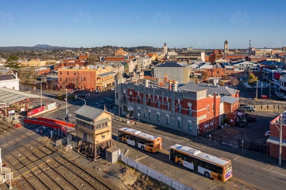 Aerial view of buses arriving at a regional railway station - Australian Stock Image