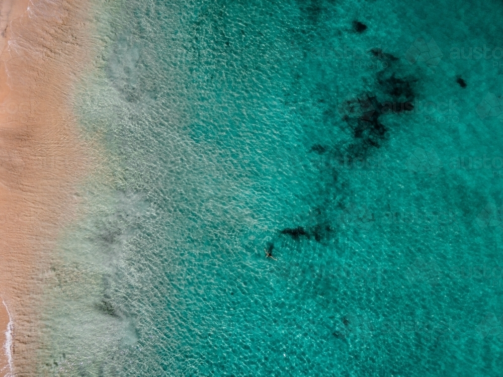 Aerial view of clear aqua water and shoreline - Australian Stock Image