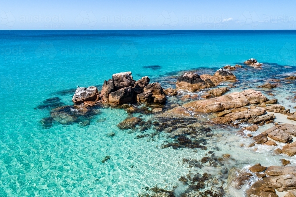 Aerial view of clear turquoise water and rocky point at Meelup Beach. - Australian Stock Image