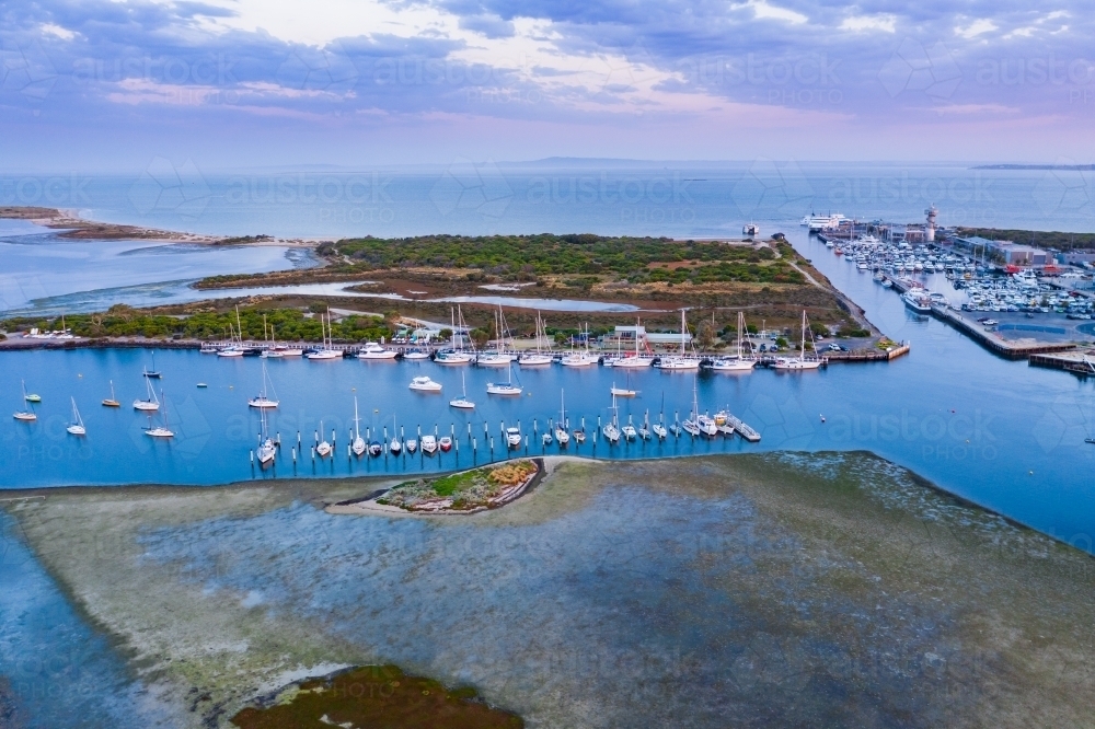 Aerial view of coastal marina at sunset - Australian Stock Image