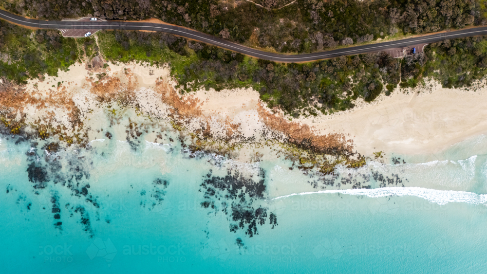 Aerial view of coastal road with turquoise water - Australian Stock Image