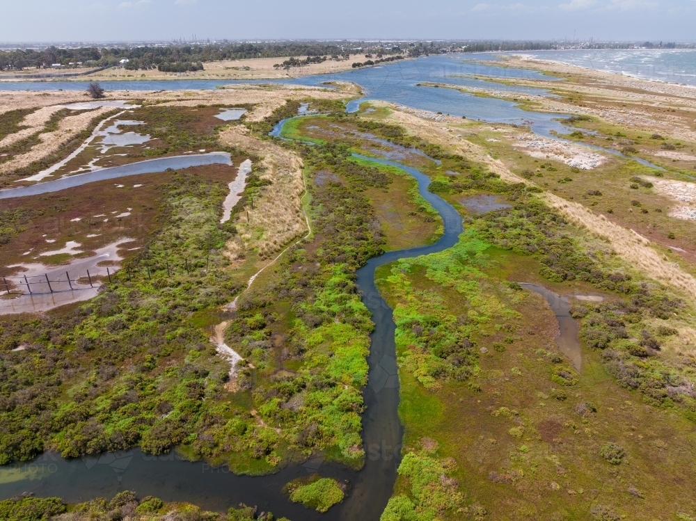 Aerial view of coastal wetlands with colourful vegetation and creeks - Australian Stock Image