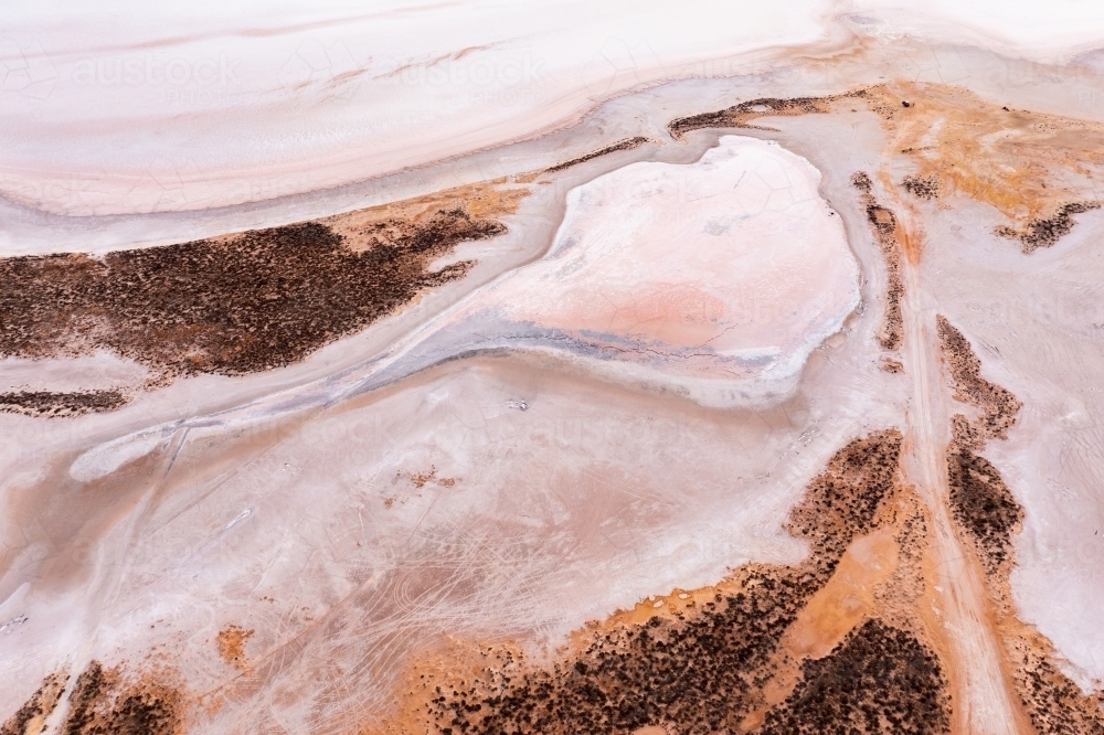 Aerial view of colourful patterns in a dry salt lake - Australian Stock Image