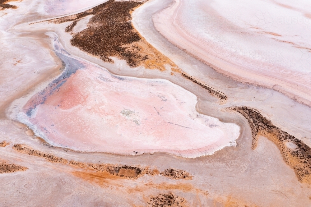 Aerial view of colourful patterns in a dry salt lake - Australian Stock Image