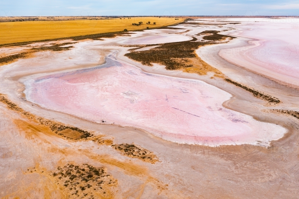 Aerial view of colourful patterns in a dry salt lake - Australian Stock Image