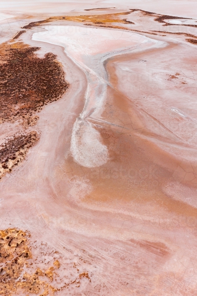 Aerial view of colourful patterns in a dry salt lake - Australian Stock Image