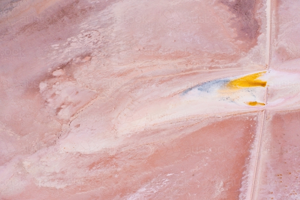 Aerial view of colourful patterns in a pink salt lake - Australian Stock Image