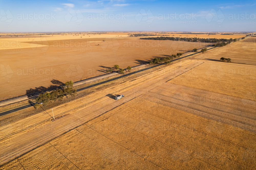 Aerial view of combine harvester on the field. : Austockphoto Aerial view of combine harvester on the field. - Australian Stock Image