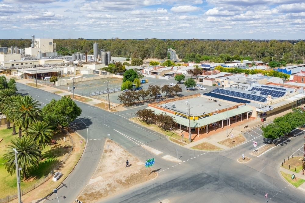 Aerial view of crossroads in a regional town and surrounding buildings - Australian Stock Image