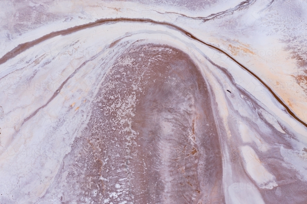 Aerial view of curved line patterns in dry salt lake - Australian Stock Image
