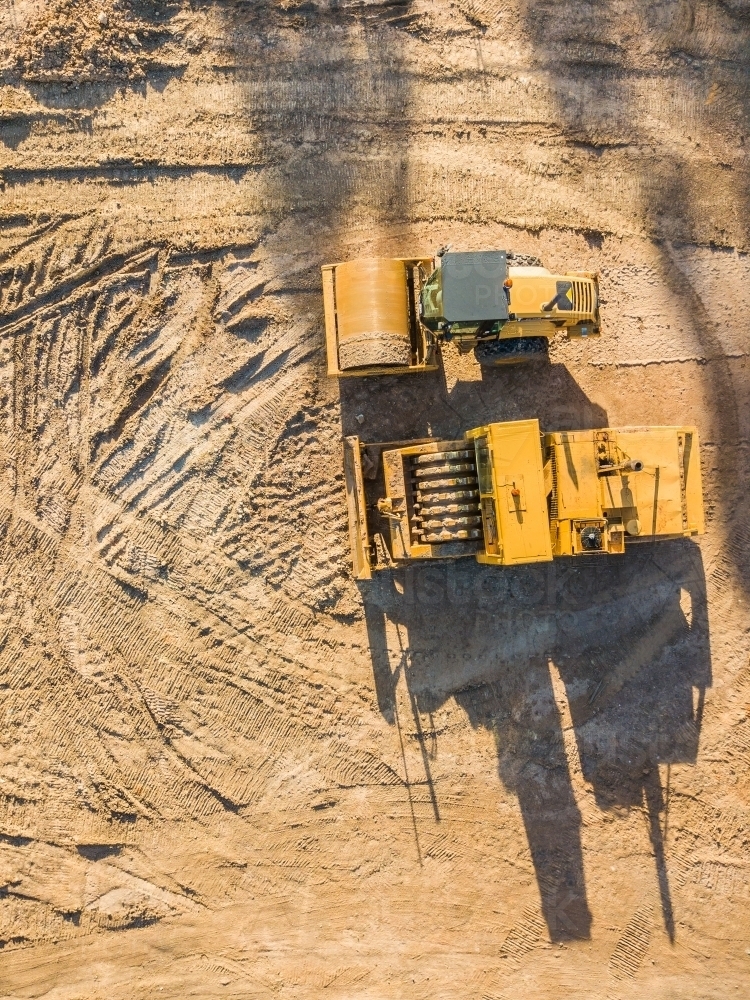 Aerial view of earthmoving machinery on a construction site - Australian Stock Image