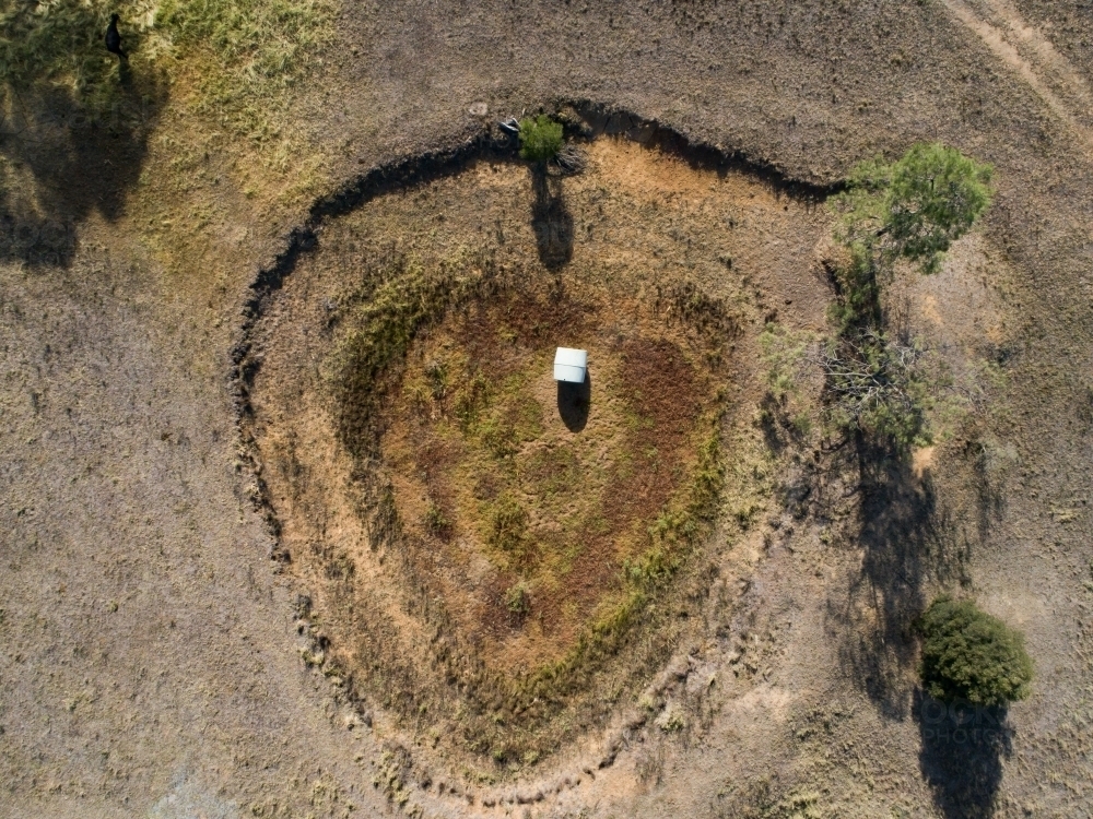 Image of Aerial view of empty dam in dry paddock Austockphoto