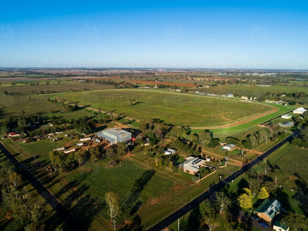 Aerial view of empty Narromine horse race track on bright sunlit morning in good season - Australian Stock Image