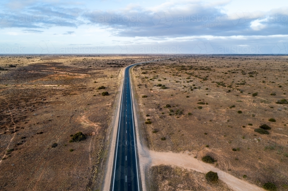 Aerial view of Eyre Highway and Nullarbor Plain near Cocklebiddy, Western Australia. - Australian Stock Image
