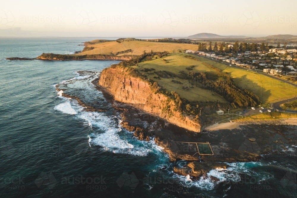 Aerial view of Gerringong headland and rocky coastline - Australian Stock Image