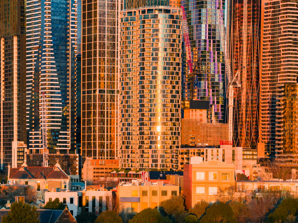Aerial view of golden light on tall city skyscrapers at Melbourne in Victoria - Australian Stock Image