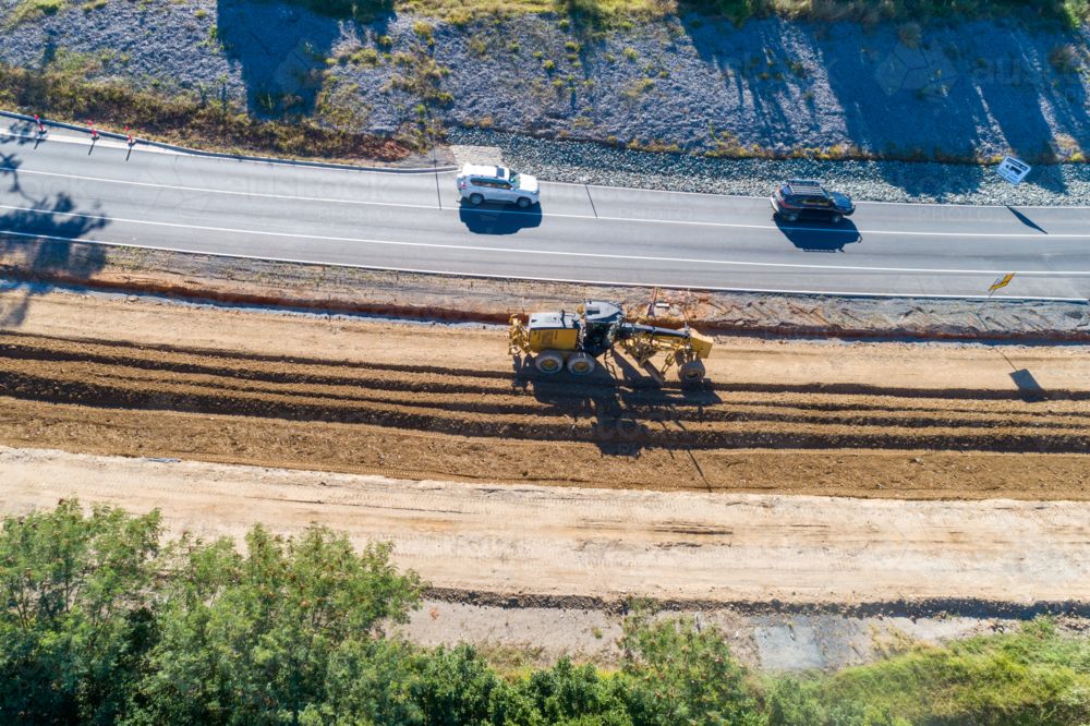 Aerial view of grader and roadworks. - Australian Stock Image