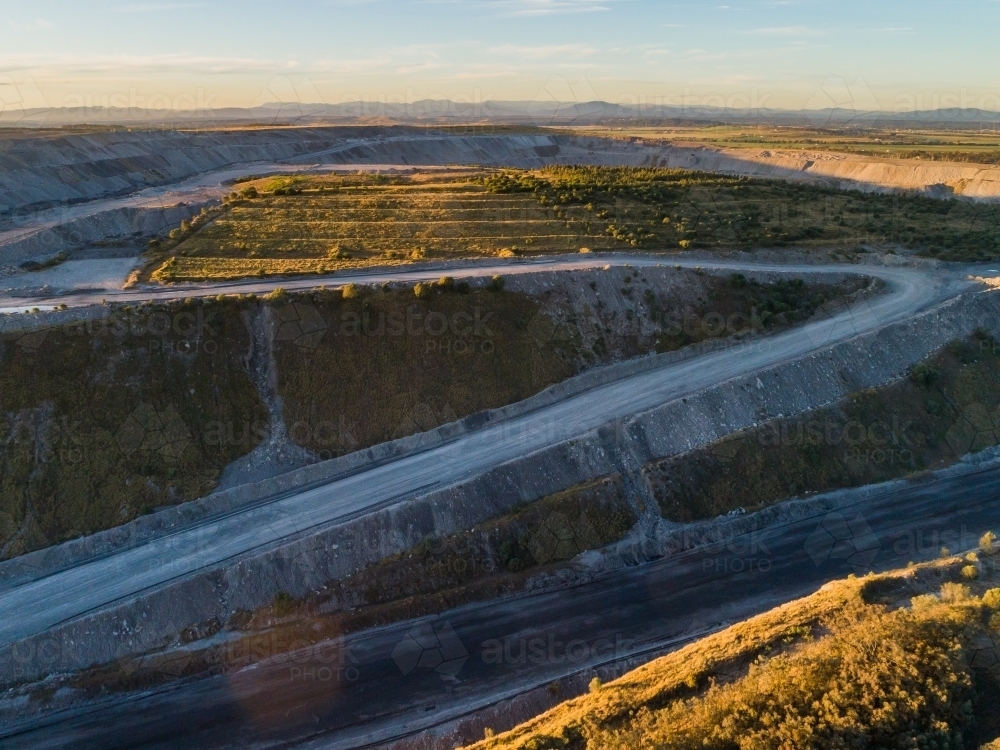 Aerial view of grass growing on open cut coal mine slag heaps - Australian Stock Image
