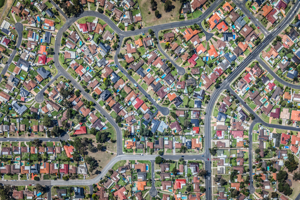 Aerial view of high-density suburban neighbourhood in maze-like residential area - Australian Stock Image