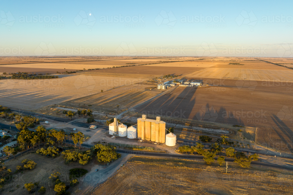 Aerial view of Hopetoun grain silos and farmland in golden evening light. - Australian Stock Image