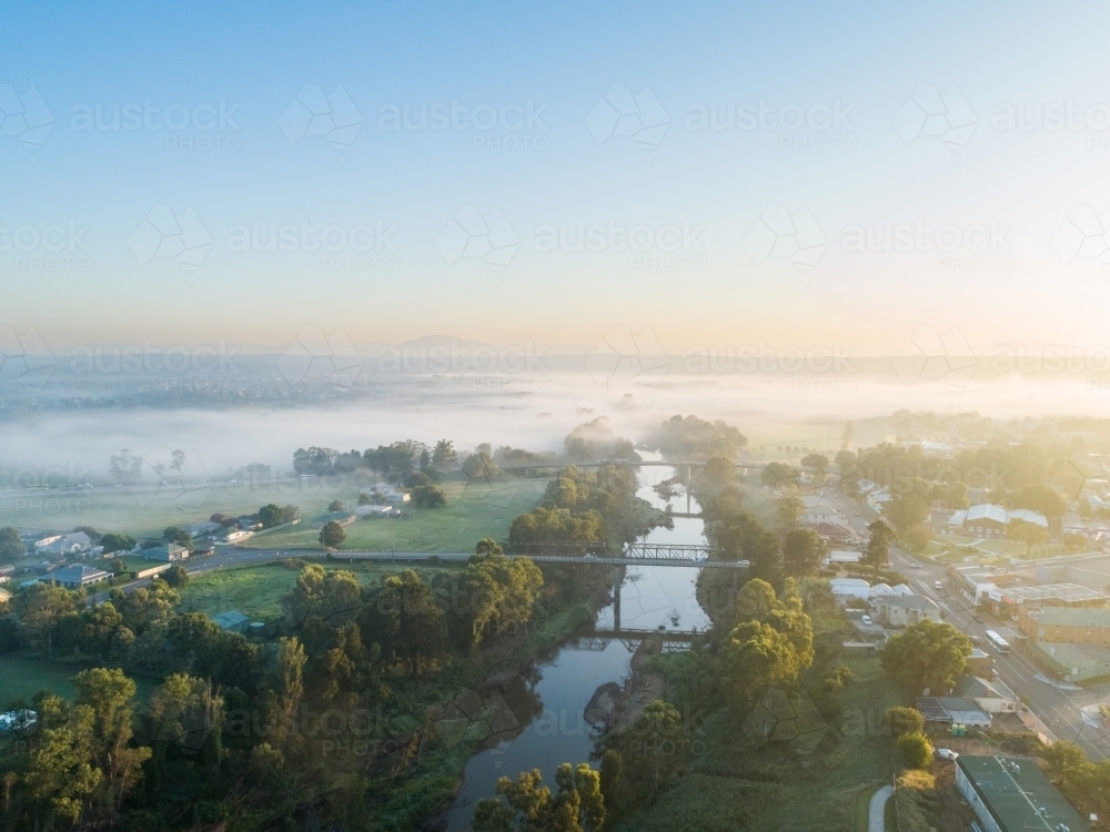 Aerial view of Hunter River at sunrise on foggy autumn morning in the Hunter Valley - Australian Stock Image