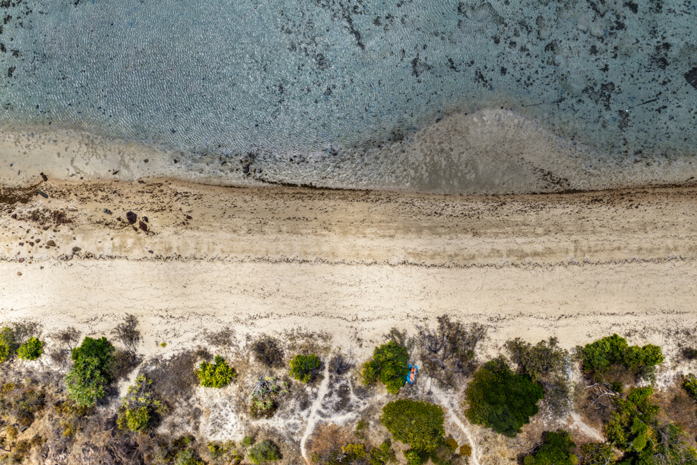 Aerial view of Hydeaway Bay showcasing its water, and beach - Australian Stock Image