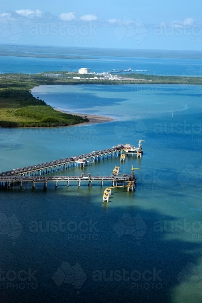 Aerial view of industrial wharves in harbour - Australian Stock Image