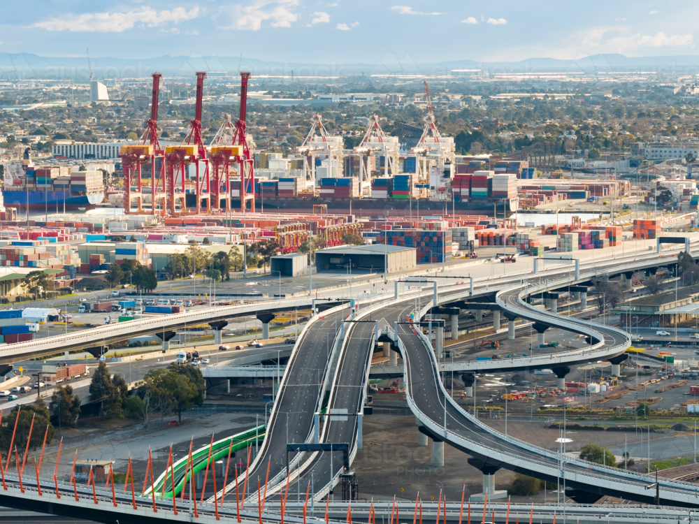 Freways With Rails Image of Aerial view of intersecting and curving freeways with shipping ...