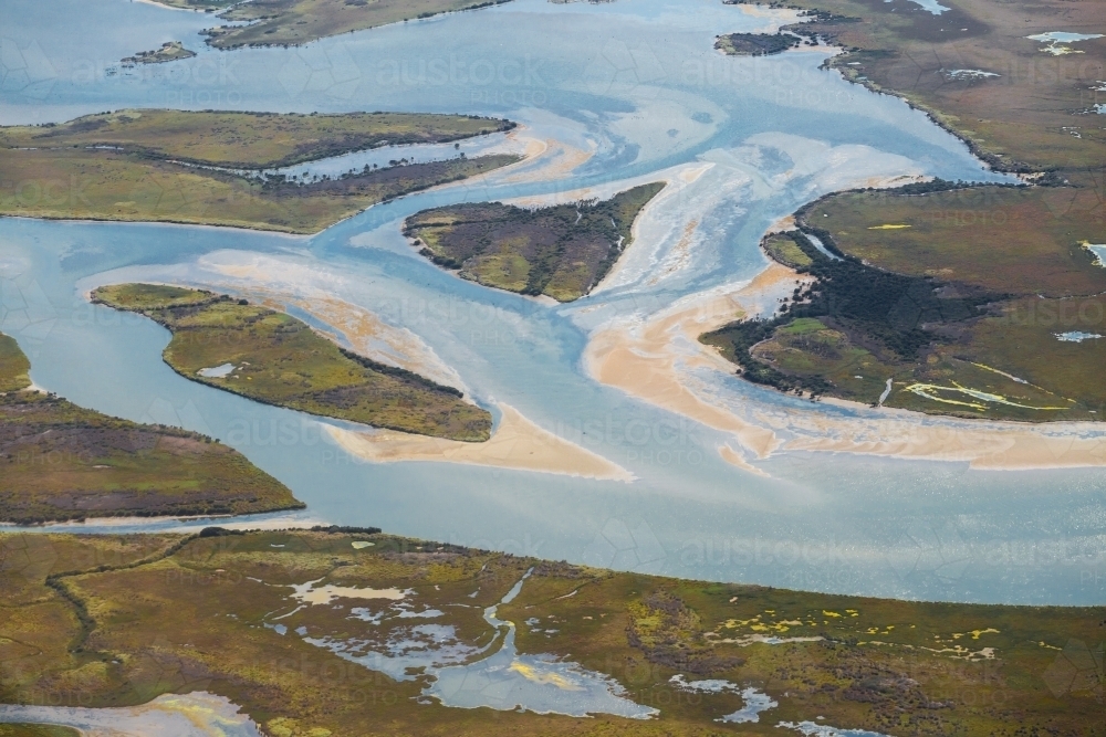 Aerial view of Lake Connewarre flowing into the Barwon River - Australian Stock Image