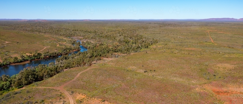 aerial view of landscape with river and access tracks - Australian Stock Image