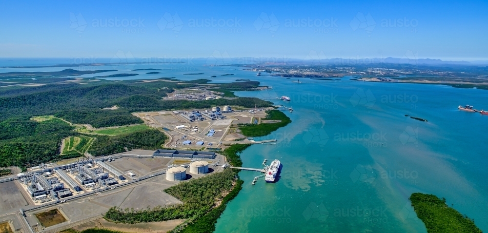 Aerial view of liquified natural gas plant and LNG ship on Curtis Island, Queensland - Australian Stock Image