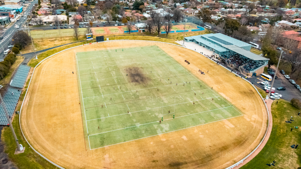 Aerial view of local sports field with dry grass field. - Australian Stock Image