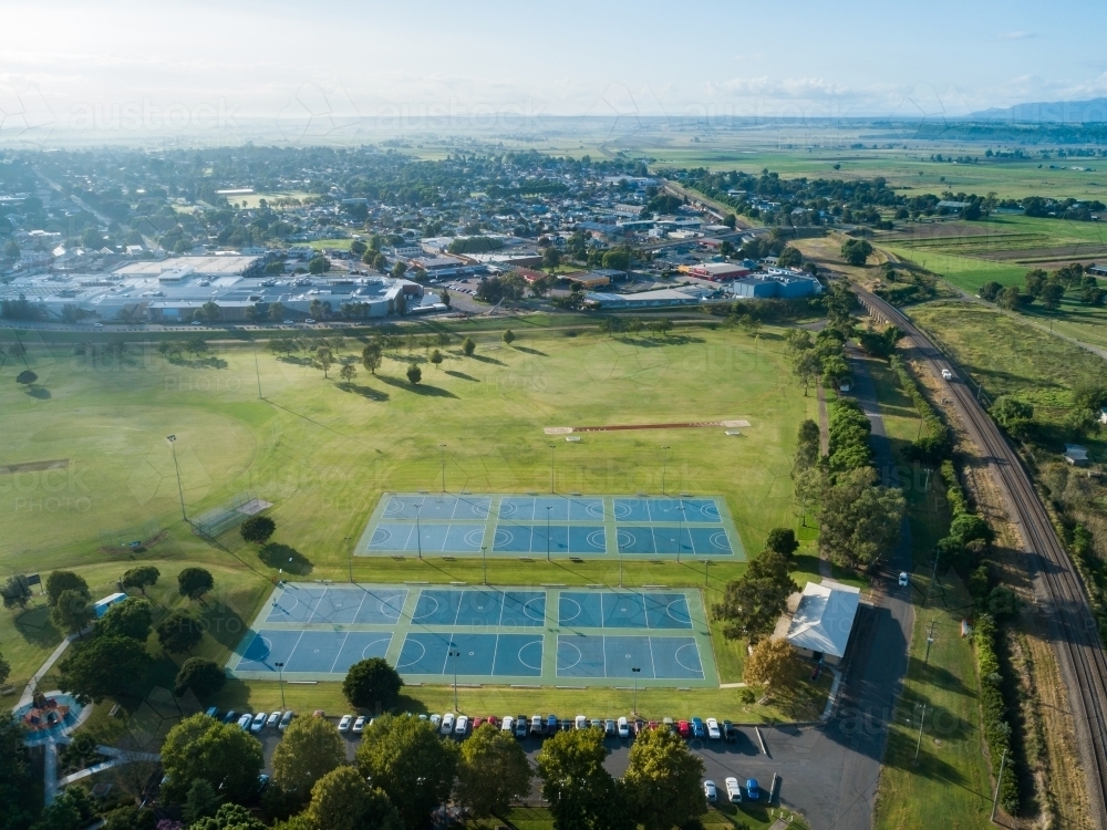 Aerial view of long jump track and pit at Cook Park  beside netball courts and sports field - Australian Stock Image