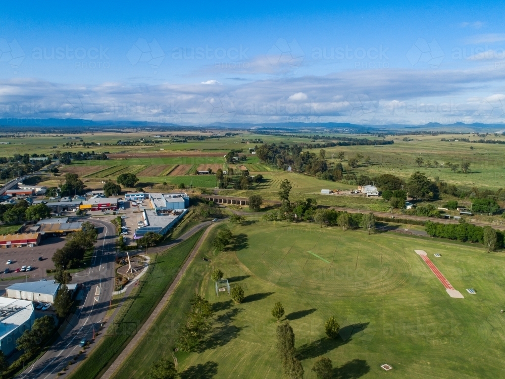 Aerial view of long jump track Park sports oval with sun dial and vegetable farm - Australian Stock Image