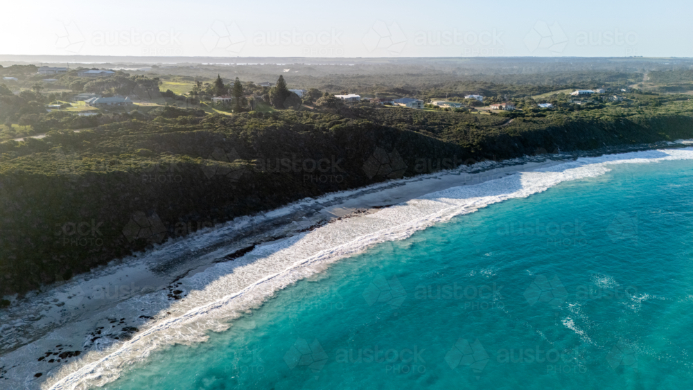 Aerial view of long stretched white sand beach with turquoise water - Australian Stock Image