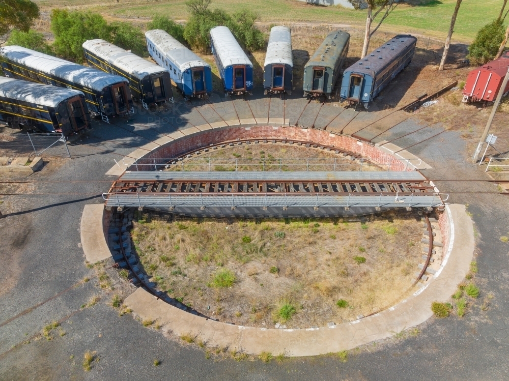 Aerial view of long train carriages lined up around a railway turntable - Australian Stock Image
