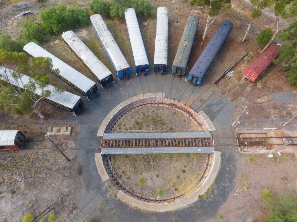 Aerial view of long train carriages lined up around a railway turntable - Australian Stock Image