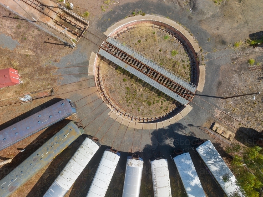 Aerial view of long train carriages lined up around a railway turntable - Australian Stock Image