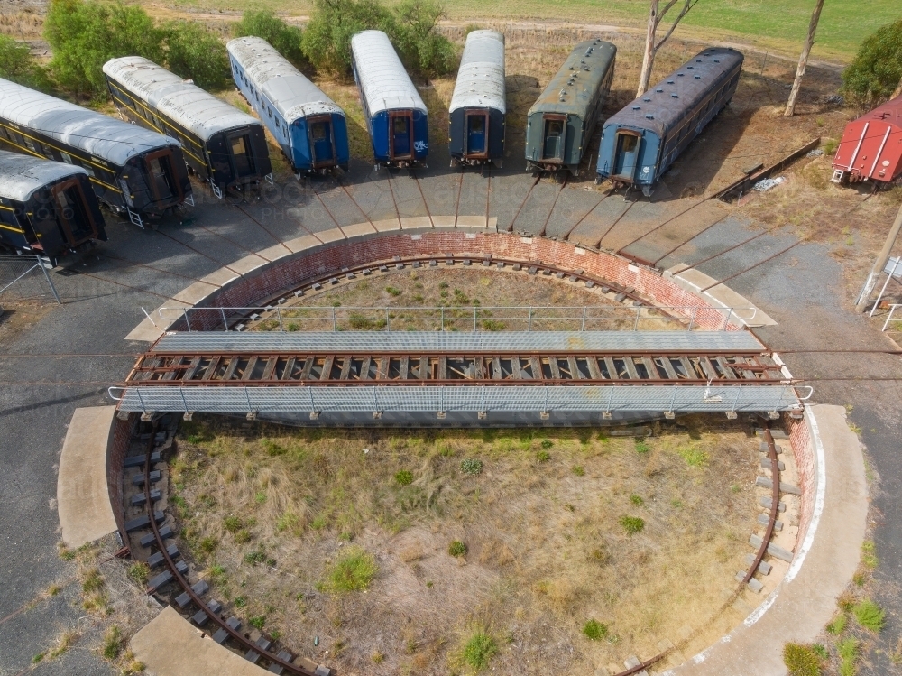 Aerial view of long train carriages lined up around a railway turntable - Australian Stock Image