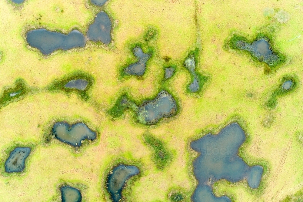 Image of Aerial view of melon holes and wetlands. Austockphoto