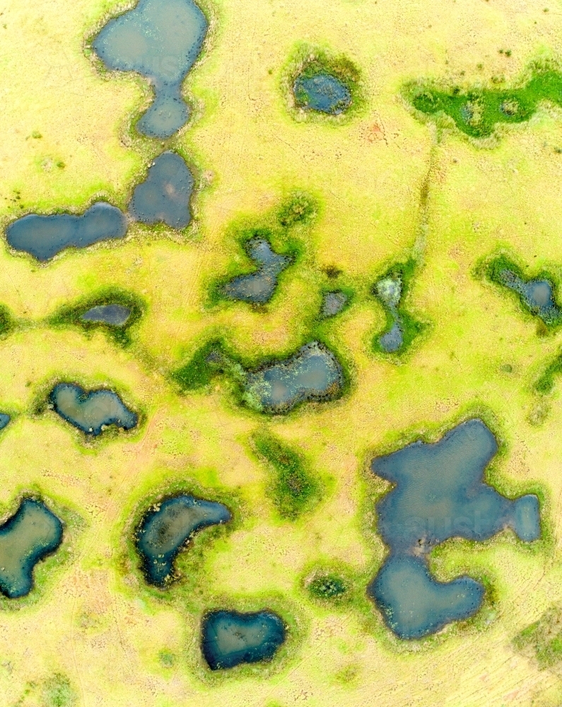 Aerial view of melon holes and wetlands. - Australian Stock Image