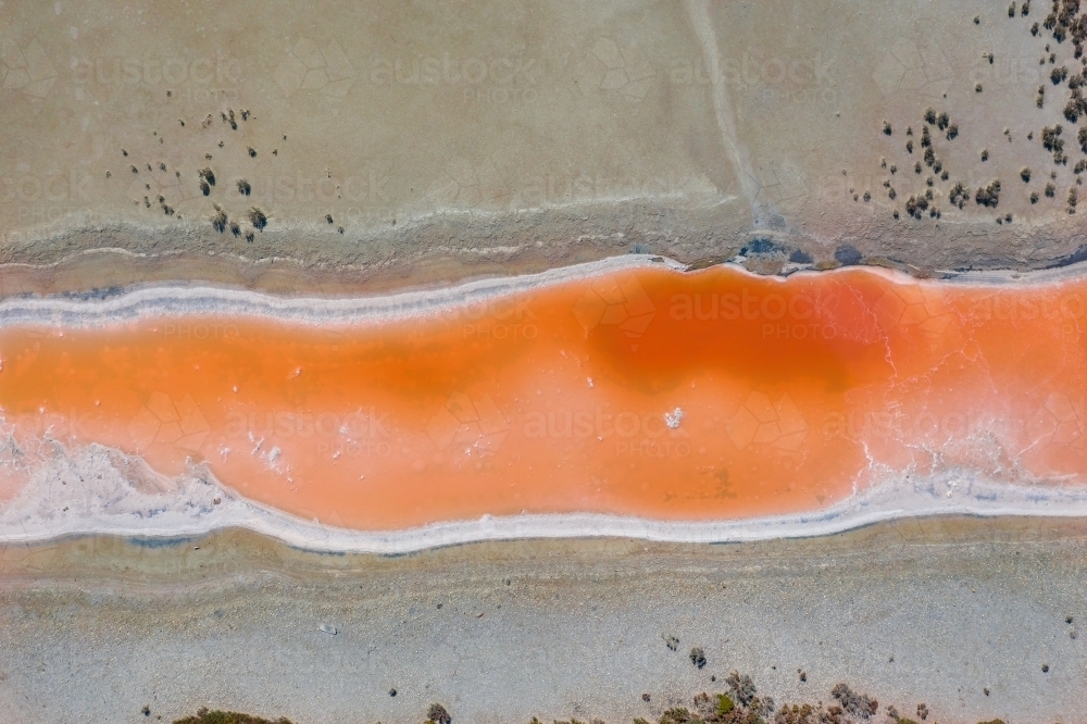 Aerial view of multi-colored salt pans at a commercial saltworks - Australian Stock Image