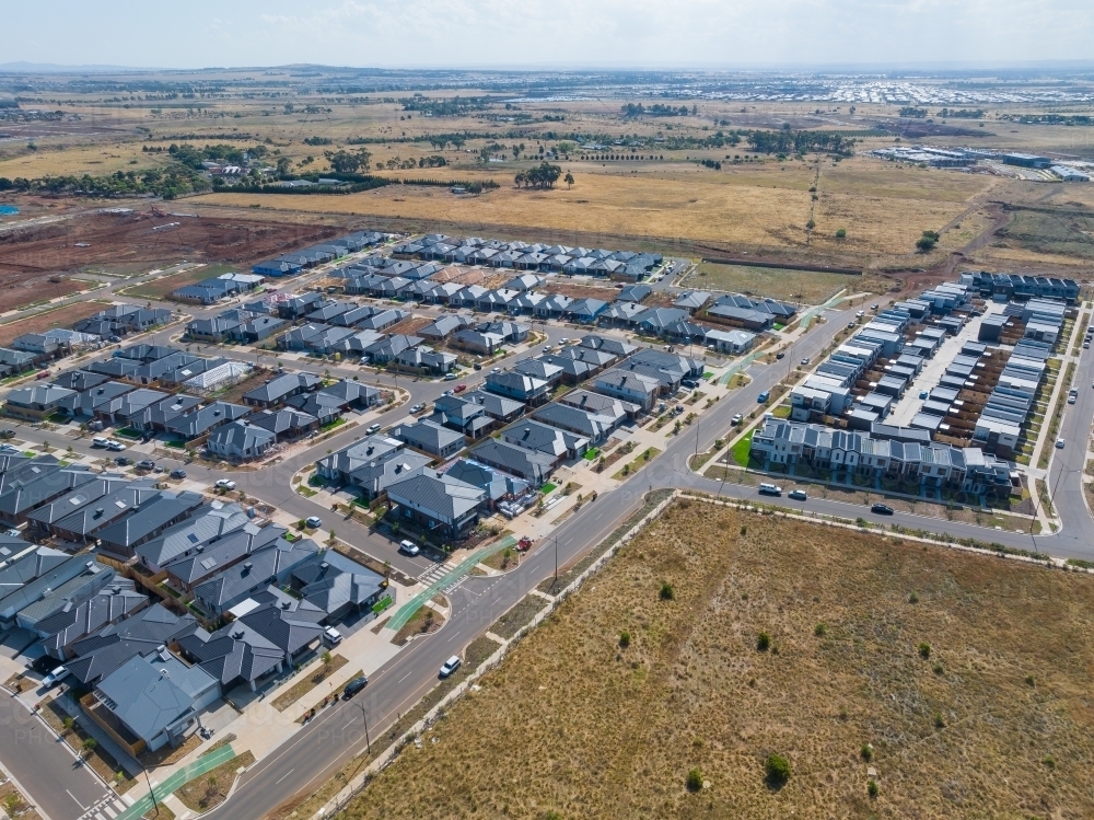 Image of Aerial view of new houses in a subdivision bordering rural ...