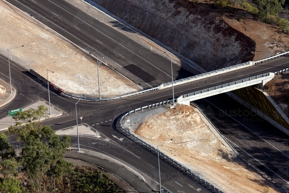 Aerial view of new roads surrounded by bushland - Australian Stock Image