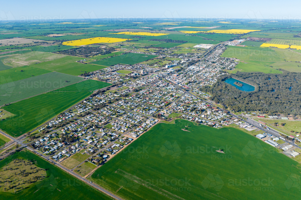 Aerial view of Nhill surrounded by lush green farmland and canola fields. - Australian Stock Image
